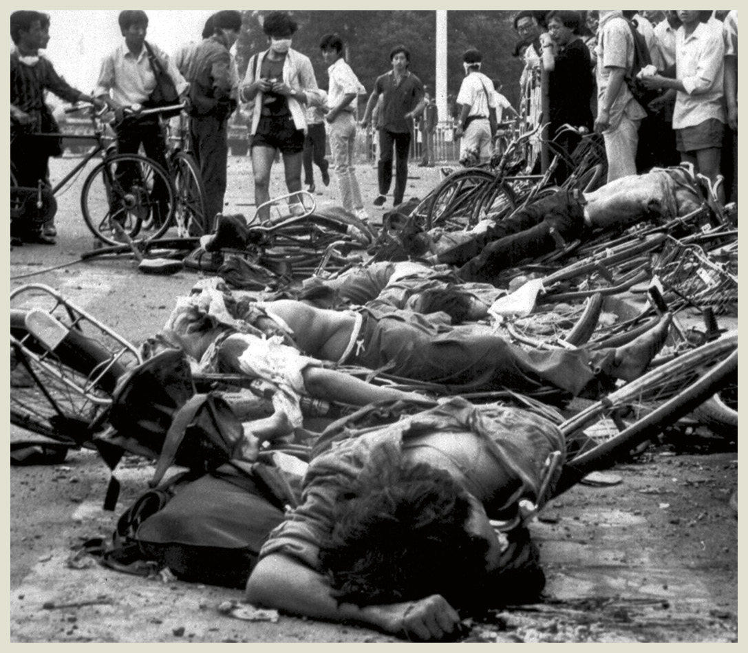 The dead bodies of protesters lie among mangled bikes near Tiananmen Square - photo 7