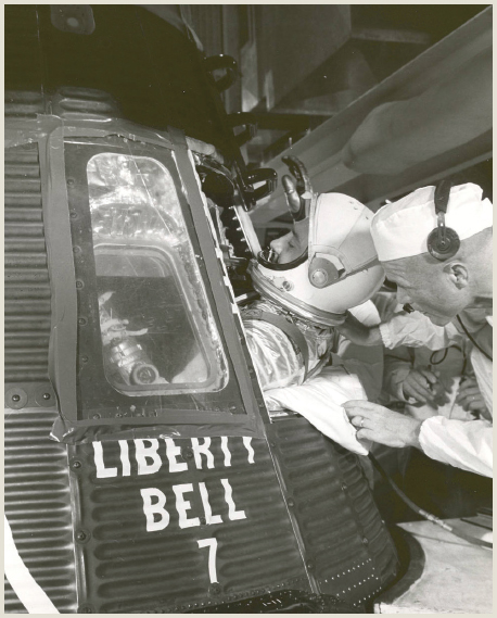 Astronaut John Glenn right helps Gus Grissom into the Liberty Bell 7 - photo 4