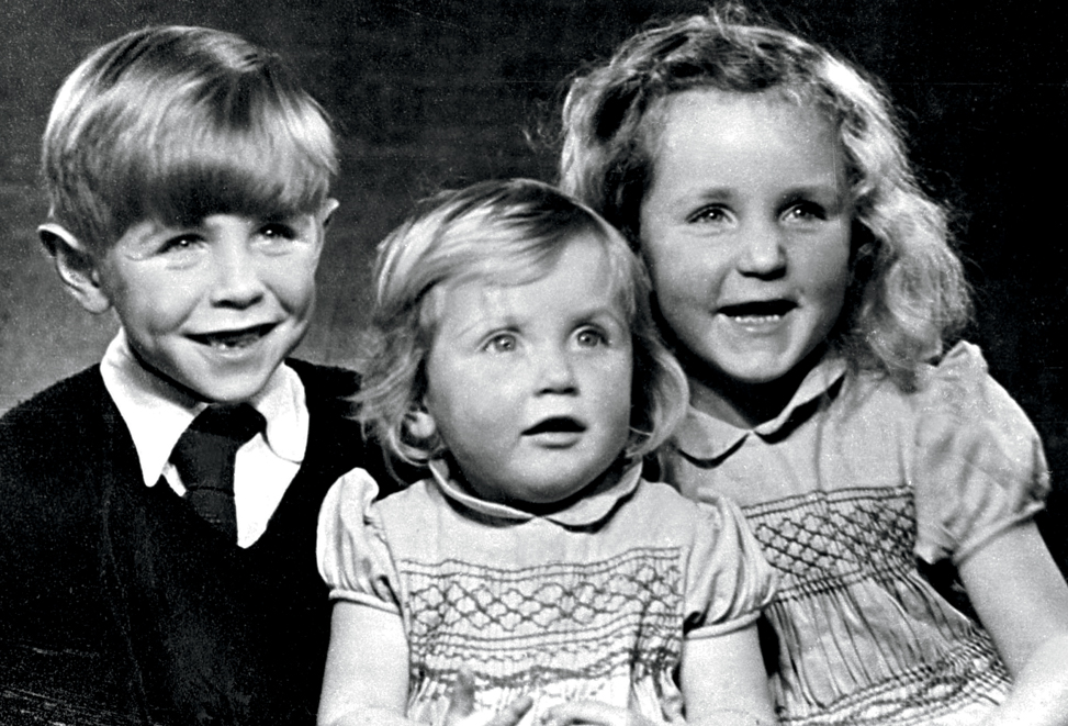 This shows Stephen Hawking as a schoolboy with his younger sisters Mary and - photo 4