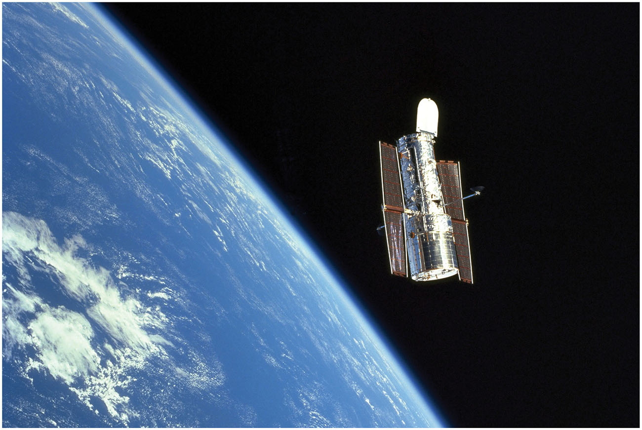 The Hubble Space Telescope floats gracefully above Earth But regardless of how - photo 7