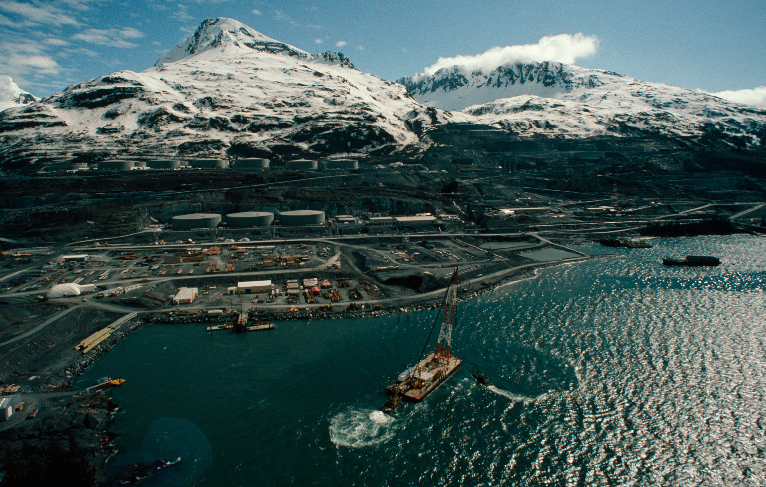 Oil storage tanks lined the shore of the harbor in Valdez Alaska when oil - photo 3