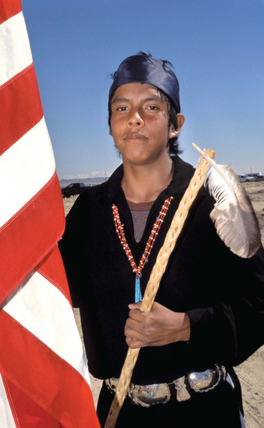 This Navajo boy is holding a coup stick made of cactus wood Men also rode into - photo 5