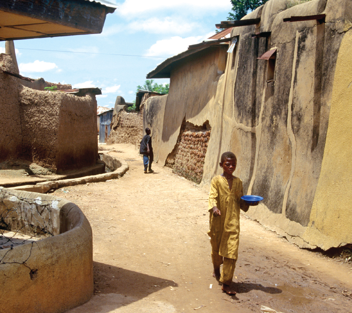 These family homes with baked clay walls are in the ancient city of Zaria in - photo 7