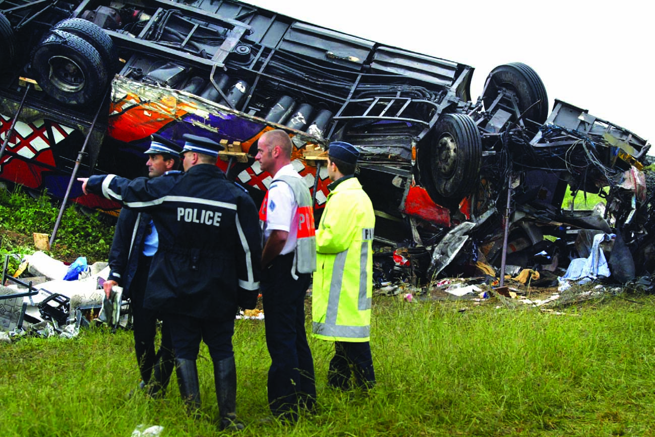 Investigators and rescue workers discuss their observations at the scene of a - photo 12