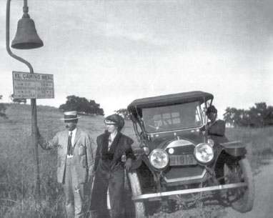 A couple stands near a decorative bell between Ventura and Calabasas on El - photo 6