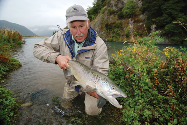 John Randolph lifts a New Zealand brown that he caught by sight fishing JOHN - photo 6