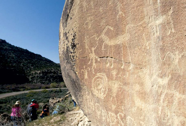 A tour group hikes past pictographs in the Ute Mountain Tribal Park Matt - photo 5