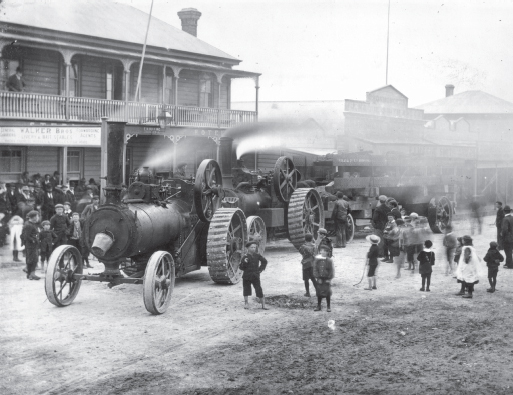 Steam tractors hauling steel beams through Waihi to the Martha Mine around 1900 - photo 4