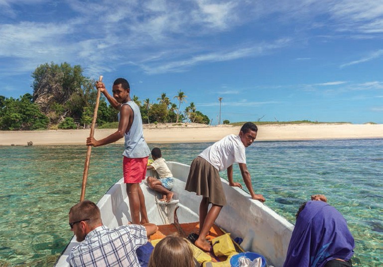 Fijians sail with tourists in the shallow waters off of an uninhabited island - photo 4