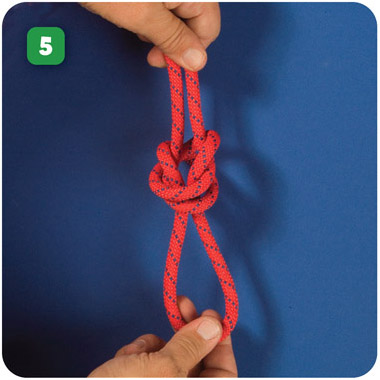 Shape the knot by pulling on the loop and the two main sections of the rope - photo 7