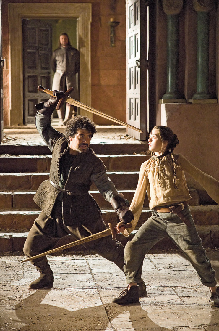 Syrio Forel Miltos Yerolemou spars with Arya Stark Maisie Williams as her - photo 6