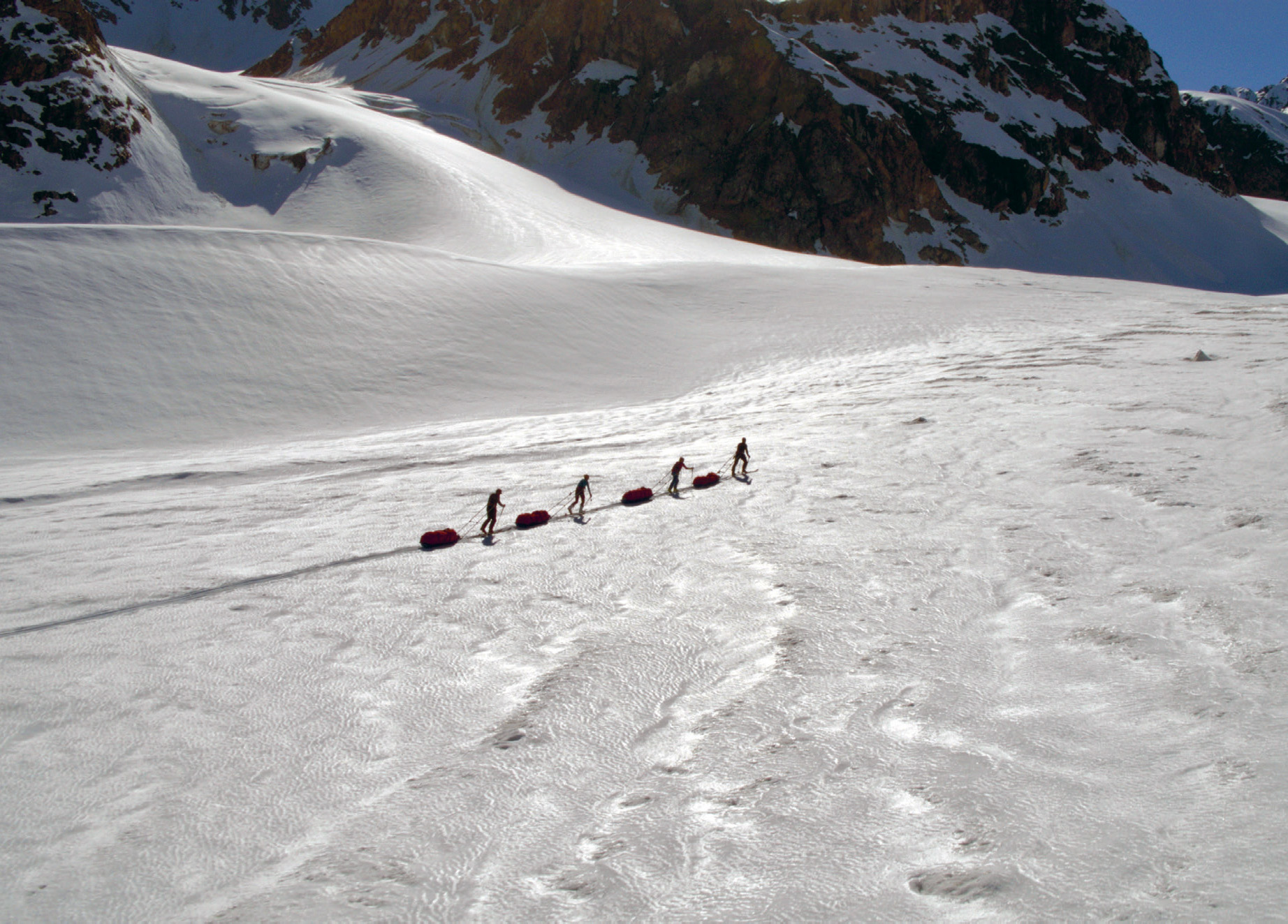 Dragging our gear up onto a vast Greenland glacier and towards a range of - photo 11