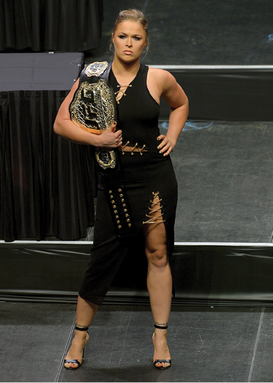 Rousey holds her championship belt before a weigh-in at the MGM Grand Garden - photo 6