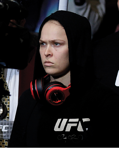 Rousey sporting the patented Ronda Rousey glare enters the arena for a UFC - photo 7