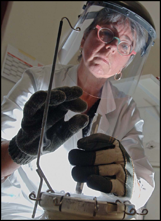 A scientist extracts frozen cells from ape and dog kidneys to be used in a - photo 4