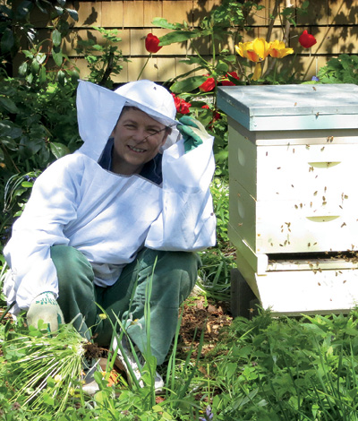 This is me beside one of the beehives in my garden CHRISTOPHER BUTTERFIELD E - photo 2