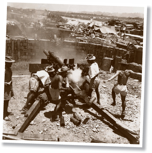 A French artillery crew shells Vietminh positions outside the base during the - photo 5