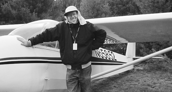 Author Philip Rossoni standing in front of a two-person Schweitzer 2-33 of the - photo 3