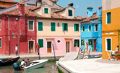 Colourful houses lining the canals of the lagoon island of Burano Venice - photo 7