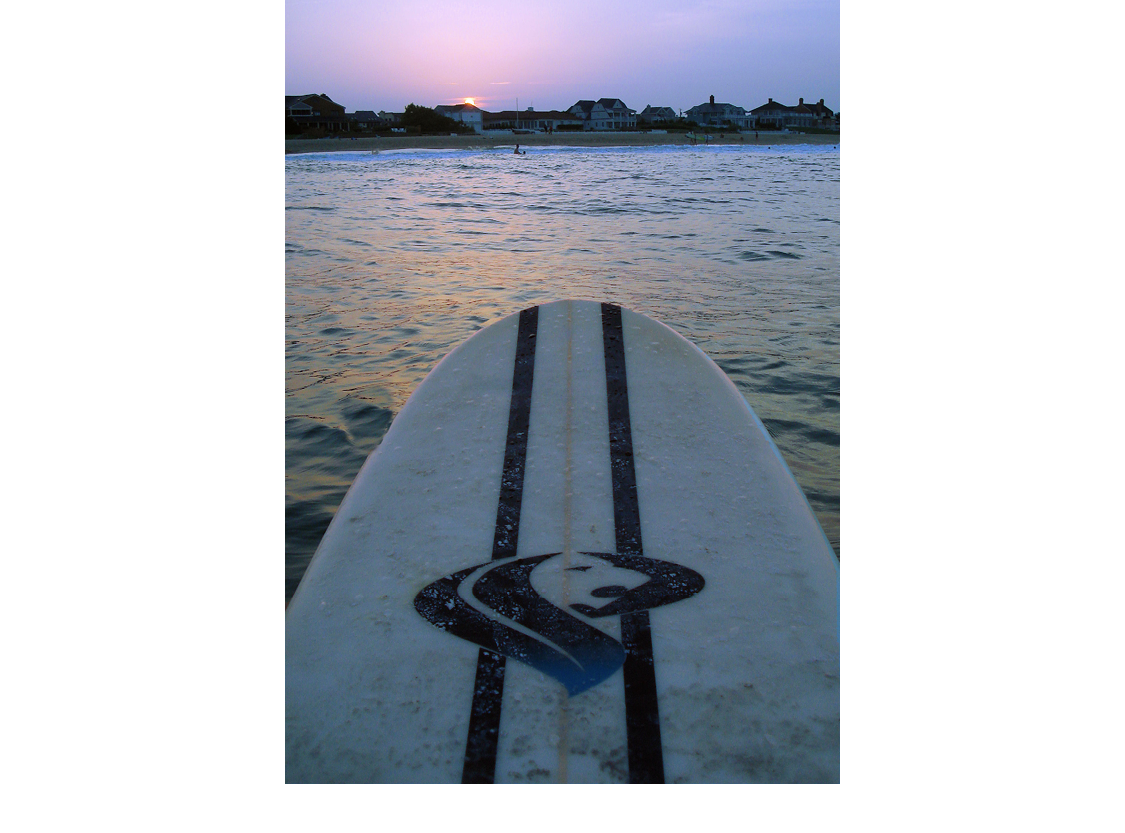 The surfer is waiting to catch a wave on his longboard Longboards are usually - photo 5