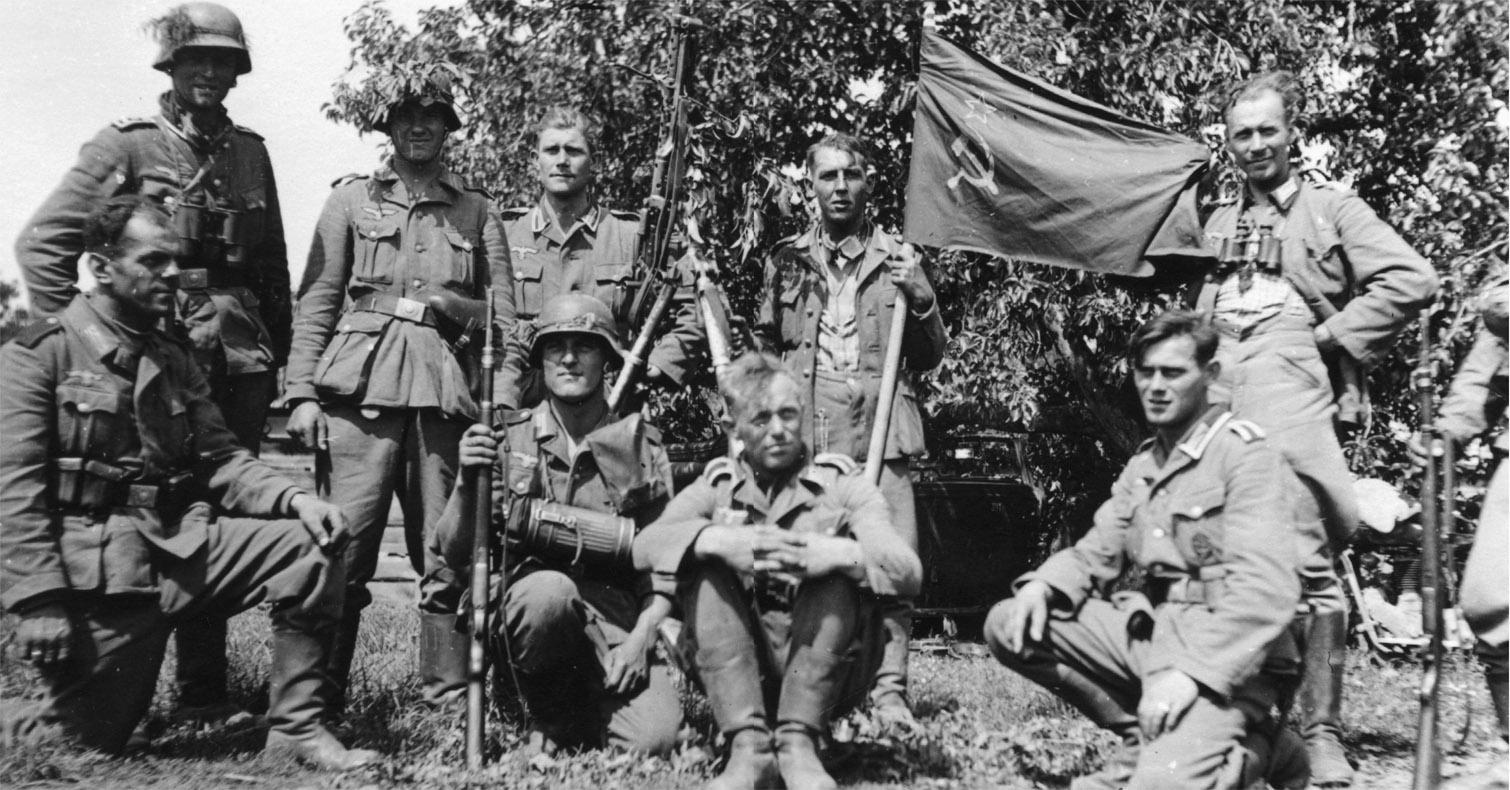 German soldiers pose with a Soviet flag The idea was to conduct a war of - photo 3