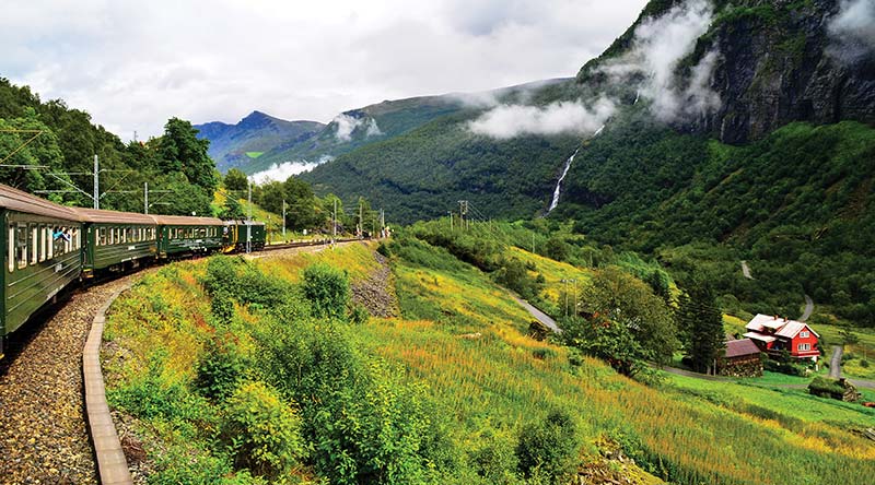 Scenic Railways The Bergen Line descends through a lush valley to a fjords - photo 14