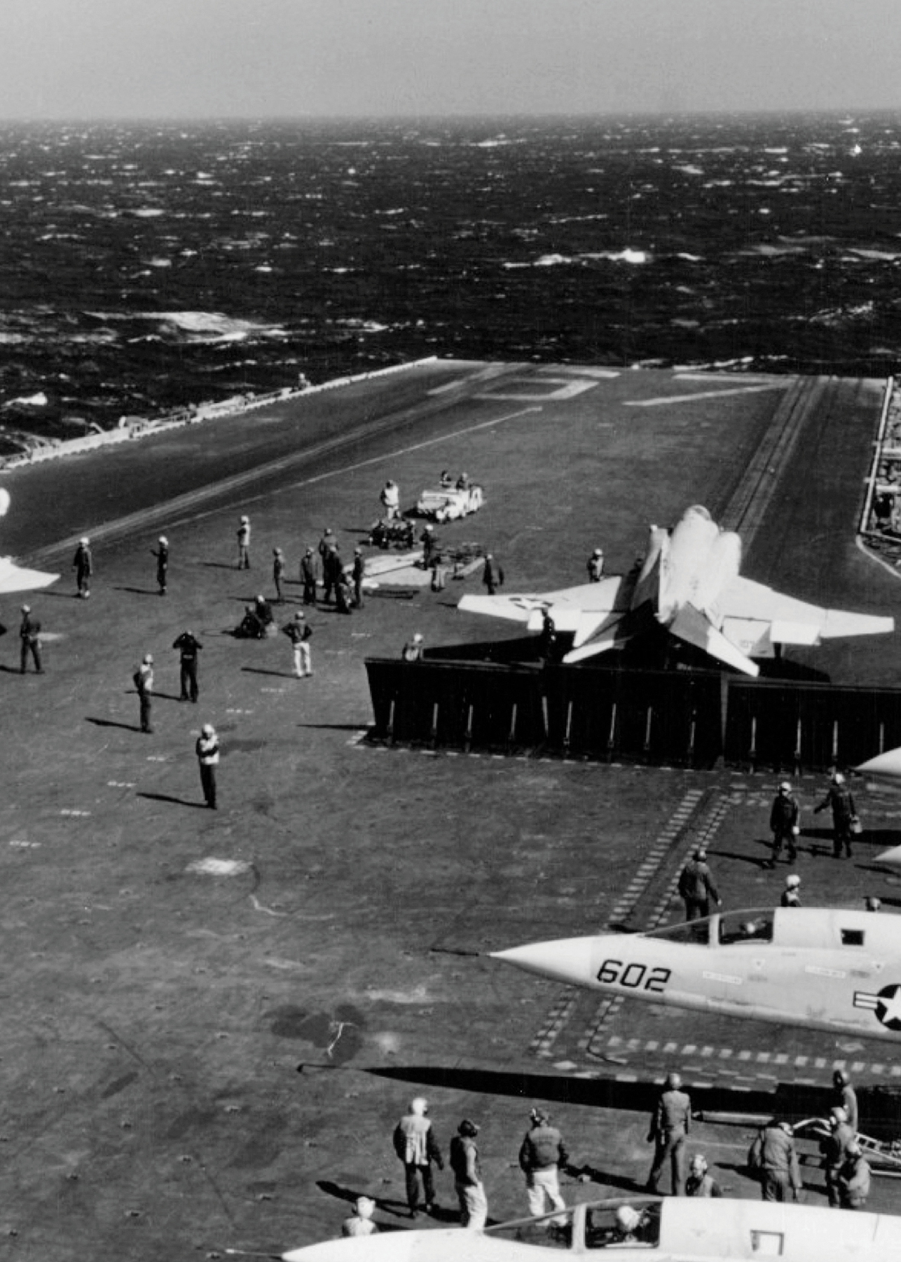 Two US Navy F-4 Phantom II fighter aircraft are readied for launch from the - photo 3