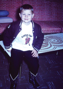 Sitting on Moms handmade winged wheel mosaic table in my Number 9 attire - photo 15