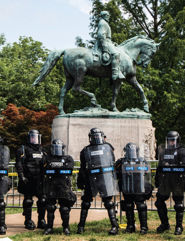 Riot police stood in front of the statue of General Robert E Lee during the - photo 5