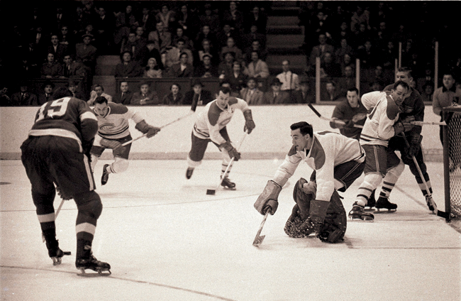 Jacques Plante prepared to block a shot without wearing a mask Goaltenders - photo 12