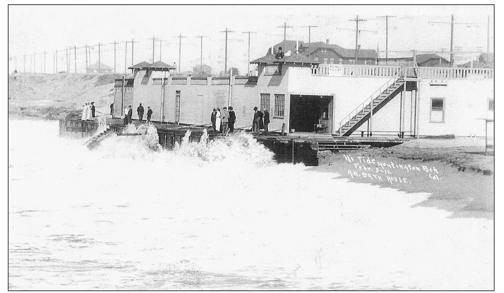 The high tide and surf pounds the west side of the pier Bath House in this - photo 5