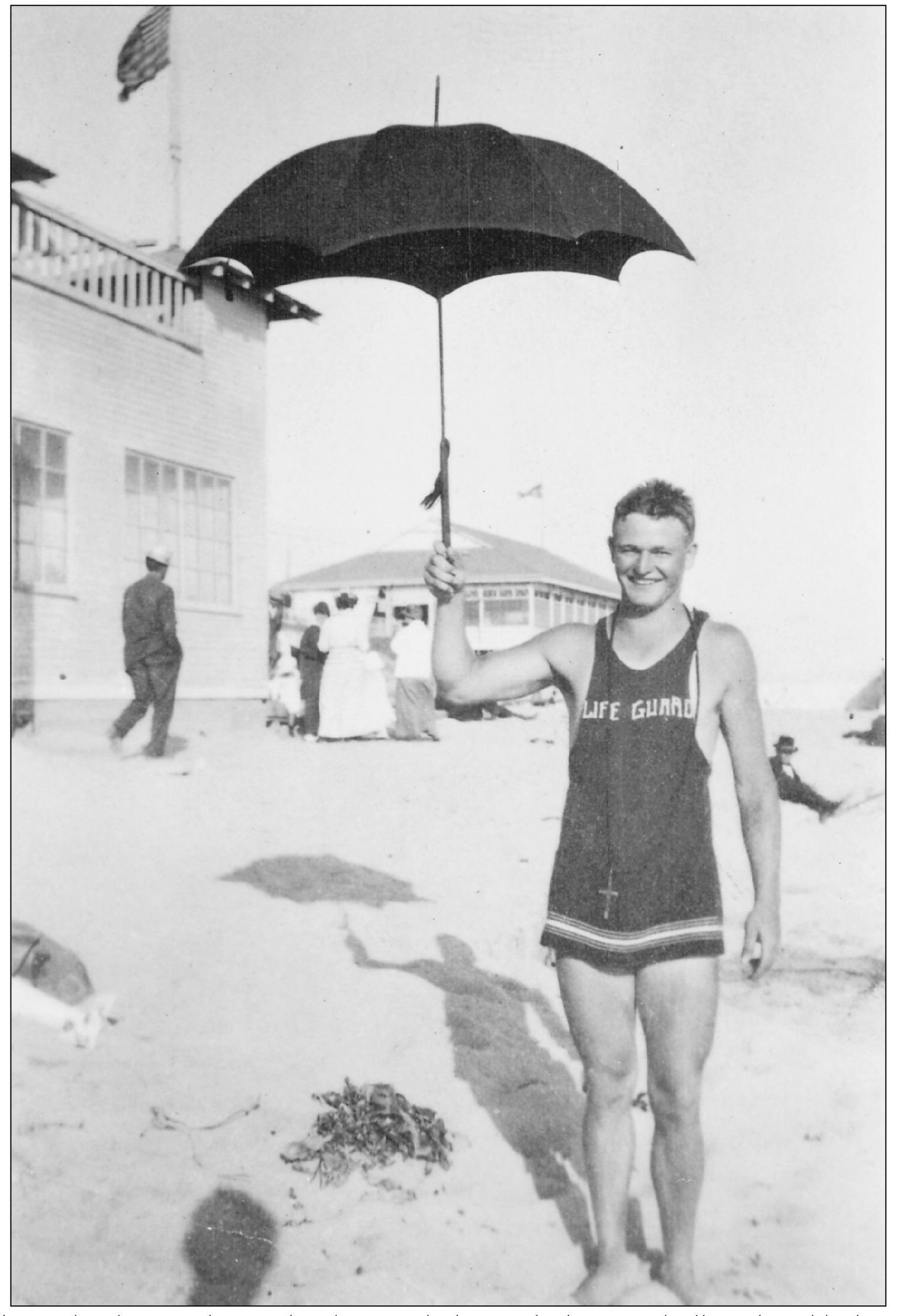 John Paul Helme stands near the Plunge with the standard-issue umbrella and - photo 7