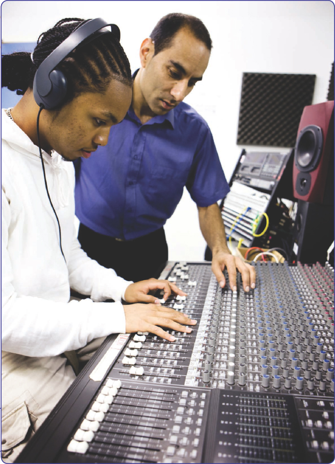 A student learns the functions of sound recording equipment from his - photo 3