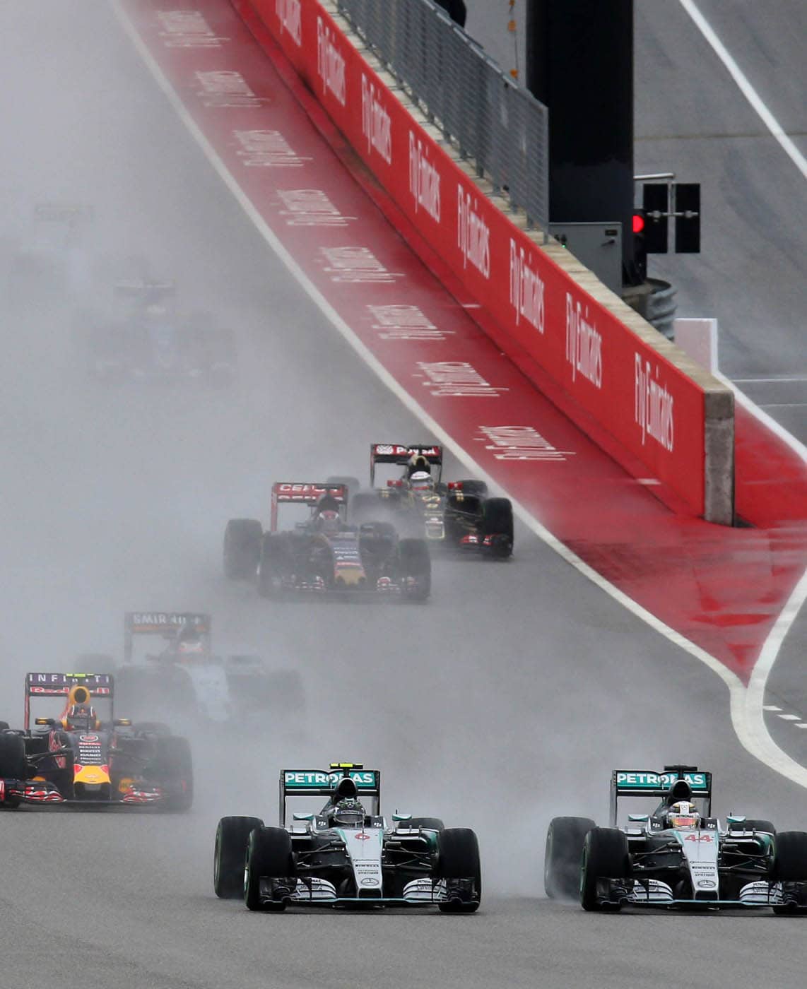 Mercedes pair Lewis Hamilton 44 and Nico Rosberg fight into the uphill first - photo 4