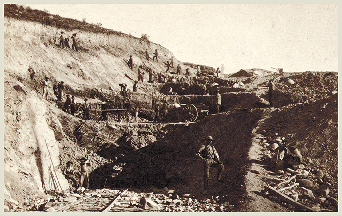 Railroad workers in 1868 remove rock and soil called digging out a cut in - photo 4