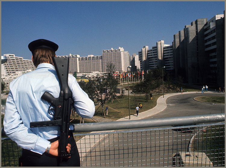 A West German police officer stood guard as Olympic events continued during the - photo 4