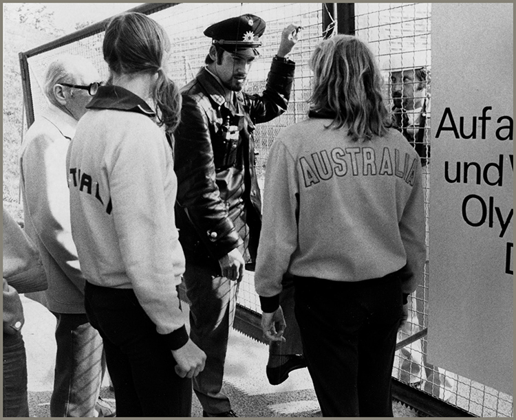 A police officer blocked the gate to the Olympic Village as two Australian - photo 7