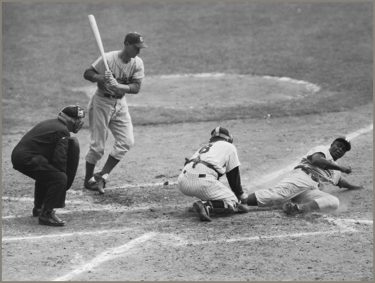 Robinson slides under the mitt of Yankee catcher Yogi Berra to steal home in - photo 8