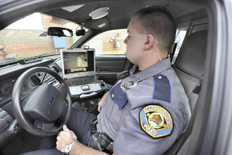 A Scarborough Maine police officer views an image from a thermal imaging - photo 3