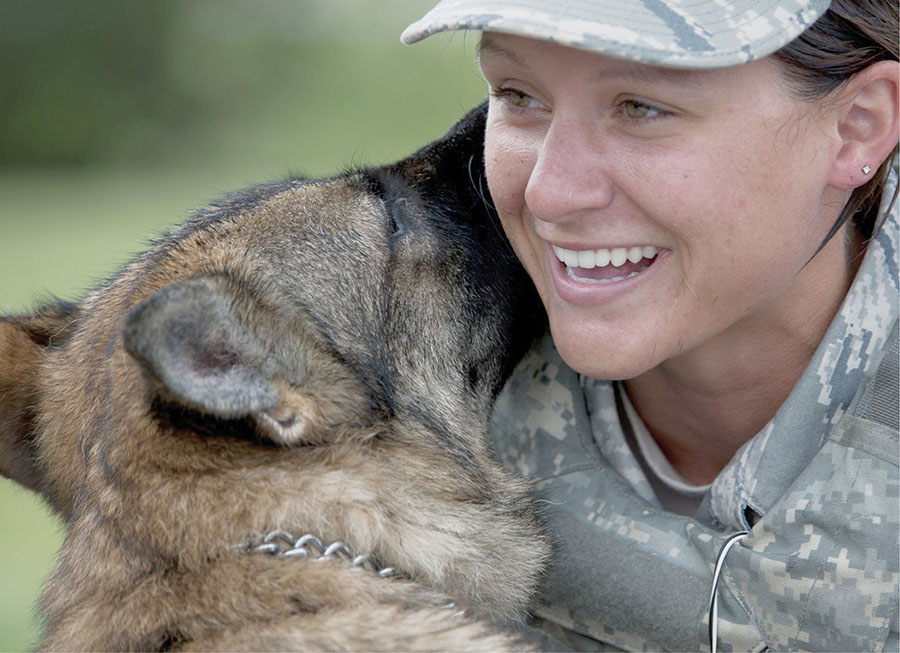 Staff Sergeant Stephanie Pecovsky and her military working dog take a break - photo 3