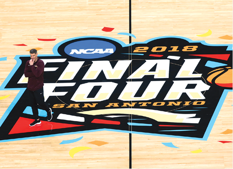 Loyola Ramblers head coach Porter Moser steps through the center court logo - photo 6