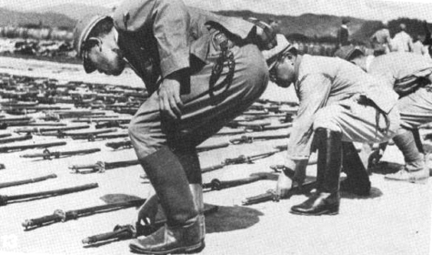 Japanese officers symbolically surrender their samurai swords to the British at - photo 13