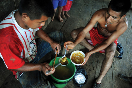 Mixing up coca paste in a clandestine lab in Putumayo Colombia Oliver - photo 3