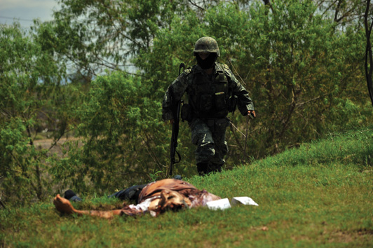 A soldier at the scene of a cartel killing in Sinaloa Fernando Brito - photo 9