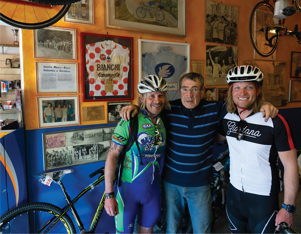 Italian cycling legend Tulio Rossi poses with Stephen and Rob in his bike shop - photo 13