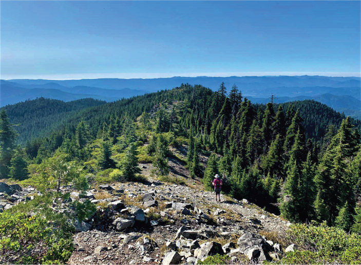 Julie Harris admires the breathtaking vista below the summit of Mount Elijah in - photo 1