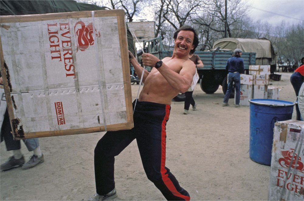 Albi hefts a box onto our cargo trucks in Lhasa bound for Basecamp Photo by - photo 5