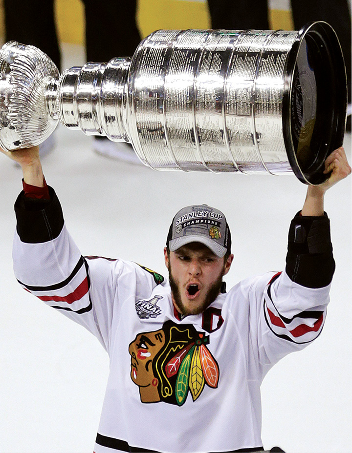 Blackhawks captain Jonathan Toews hoists the Stanley Cup after Chicagos - photo 4