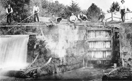 Men fishing at Lock 1 in Akron Workers cleared 230000 cubic yards of mud - photo 2