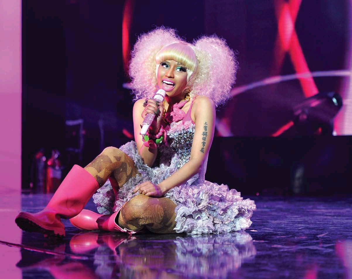 Nicki Minaj sings to the crowd in a flashy costume during the iHeartRadio Music - photo 4